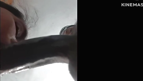 Amateur brunette girl with a sexy face is playing with dildo