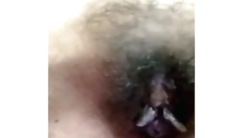 Indian hottie in a pink dress fucks her hairy pussy