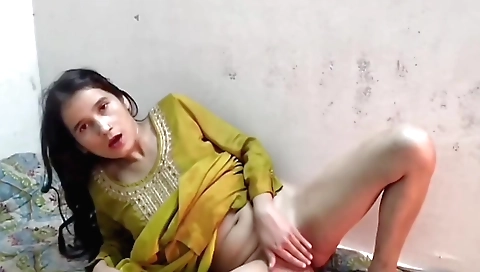 Indian teen with a red dress and black blouse in a solo video