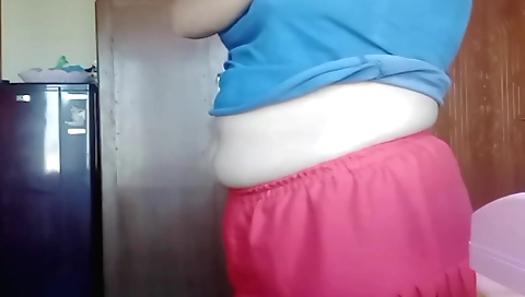 Chubby woman masturbates on the bed with a hot dildo