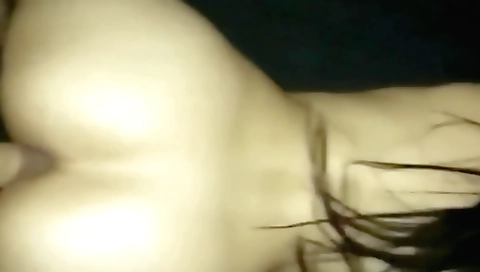 Indian beauty in a white tank top and black bra plays on webcam