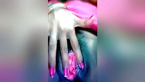 Hairy indian girl with a shaved pussy is taking out a dildo
