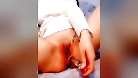 Brunette in black bikini and stockings fucks with vibrator