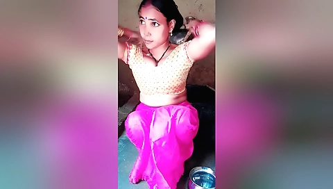 Hot brunette babe with big tits undresses in the bathroom