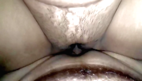 Indian hairy girl playing with her toy on the sofa