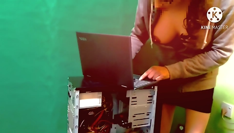 Gorgeous indian brunette woman repairs her computer