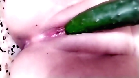 Sexy blonde masturbates with a dildo in the bedroom