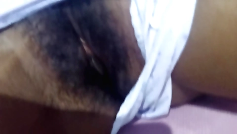 Indian hussy with a hairy pussy plays around with a dildo
