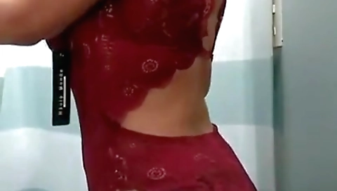 Slutty brunette naked in trial room ready to enter the office