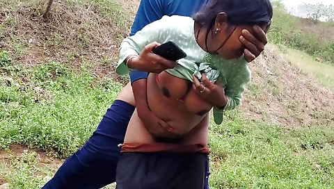 Indian hottie in a black t-shirt and shorts riding a cock outdoors