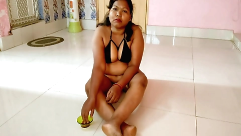 Sexy brunette housewife in sexy dress seduces the viewer